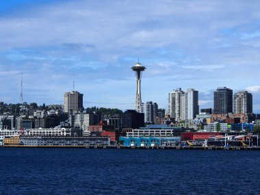 May 18, 2019 - Seattle, WA:  Water view of downtown Seattle buildings, Space Needle, Puget Sound and Cranes.