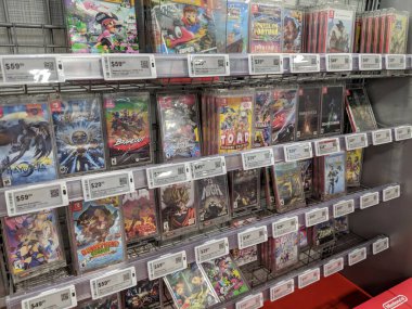 Honolulu -  February 26, 2019:  Nintendo Switch games like Mario, Donkey Kong, Doom, Cars, Fortnite, Splatoon, Captain Toad, Brawlout, Bayonetta, Just Dance, Zelda, Lego, and Kirby on Display at Best Buy. Nintendo Switch is designed to go wherever yo