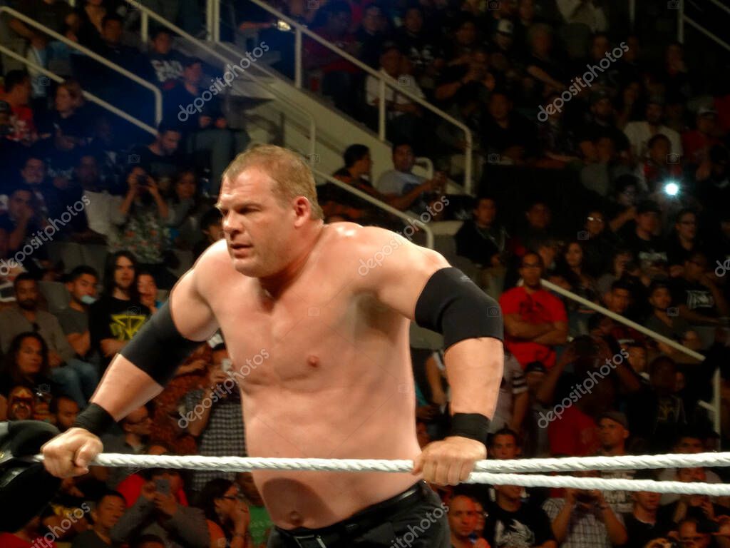 SAN JOSE - MARCH 30:  Wrestler Kane holds ropes in corner in the ring during live taping of WWE Monday Night Raw at the SAP Center in San Jose, California on March 30, 2015.