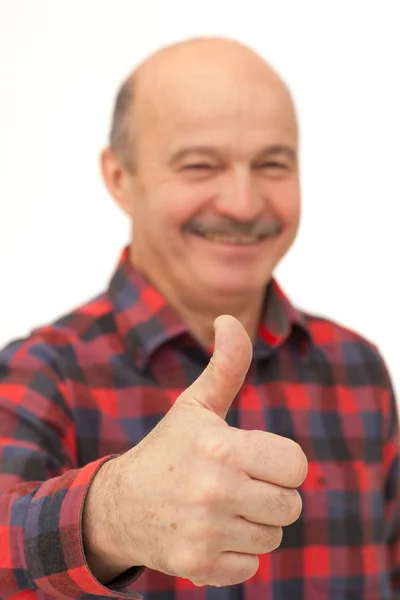 Starší muž ukazuje palec — Stock fotografie