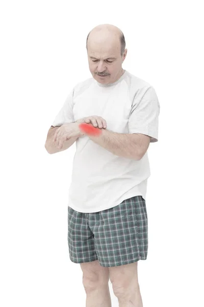 Elderly man received a wrist injury while playing sports — Stock Photo, Image