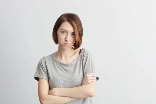 Meisje puffend uit haar wangen. — Stockfoto