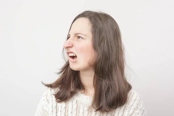 Girl makes a face of disgust. — Stock Photo, Image