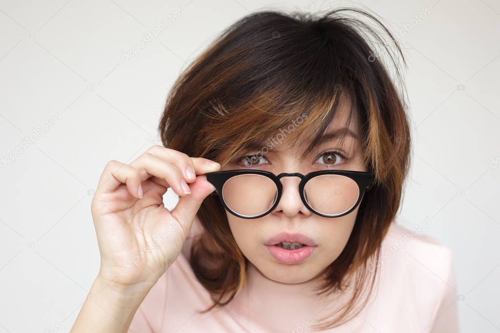 Japanese girl  takes off her glasses