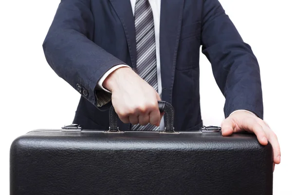 Biznesmen, trzymając w ręku Duży czarny walizka — Zdjęcie stockowe
