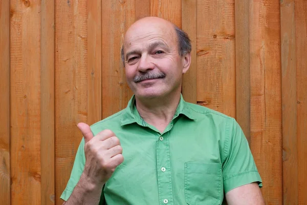 Caucasian mature man with thumbs up gesture