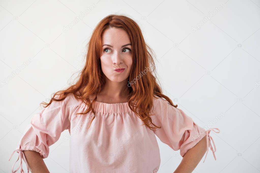 Caucasian woman model with ginger hair posing indoors