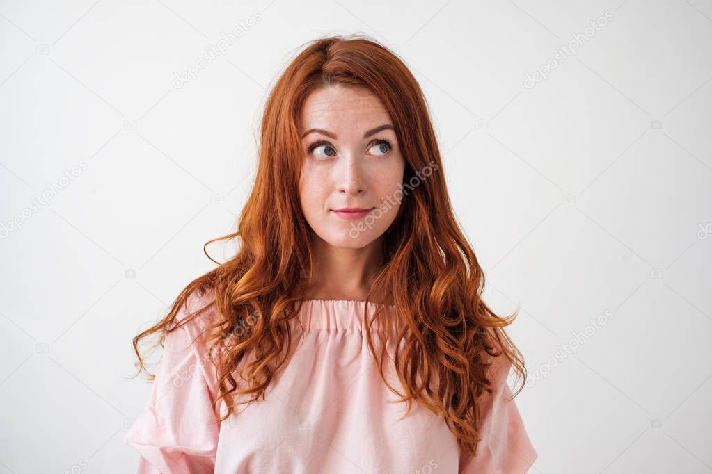 Caucasian woman model with ginger hair posing indoors