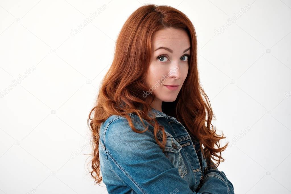 Caucasian woman model with ginger hair posing indoors