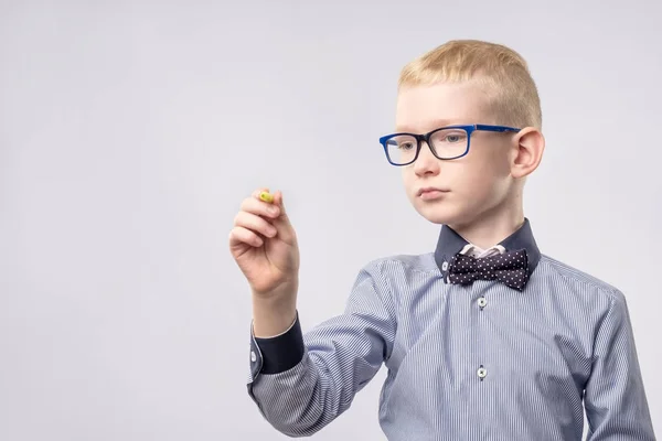 Teenage Boy writing with yellow pencil. — Stock Photo, Image