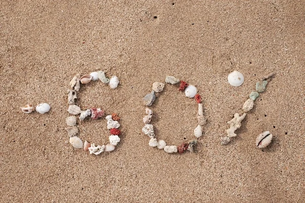 Text 60 Prozent auf Sand aus Schale — Stockfoto