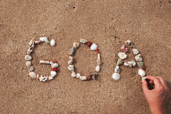 Texto GOA feito de conchas no litoral — Fotografia de Stock