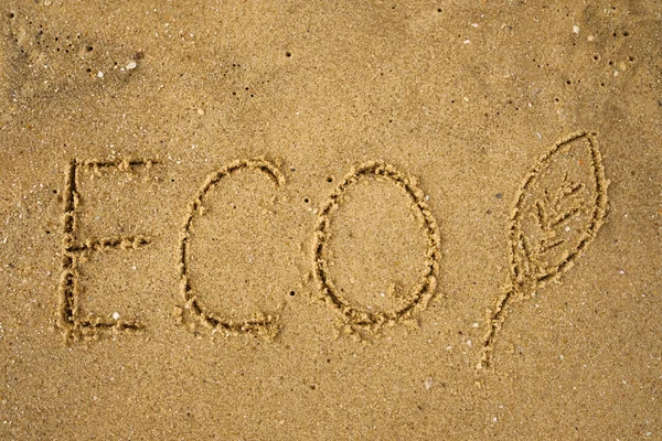 Ordet Eco frawn på gula sandstrand. — Stockfoto
