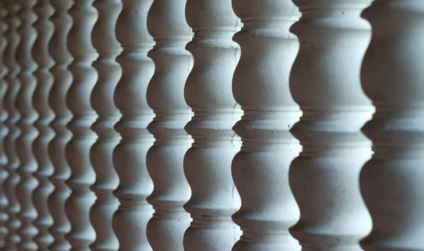 Several white curved columns in one row. — Stock Photo, Image