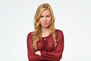 Girl with blonde long hair frowning her face in displeasure clipart