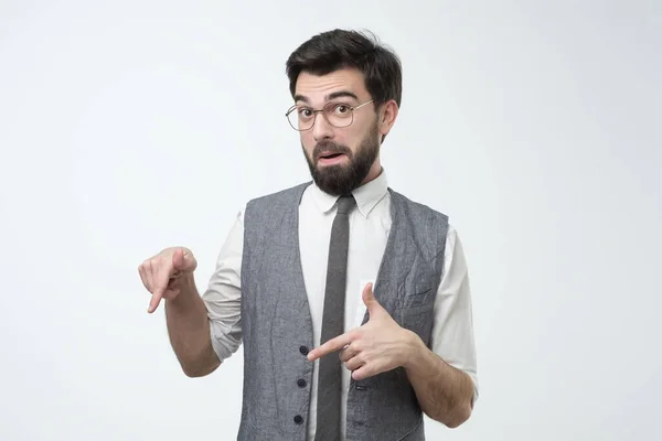 Modern young hispanic businessman pointing down on copyspace. — Stock Photo, Image
