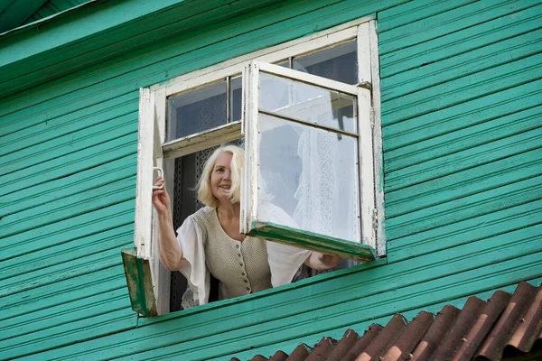 Senior Caucasian Woman Grandmother Standing Window Looking Outdoor Green Wooden — Stock Photo, Image