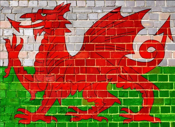 Wales vlag op een bakstenen muur achtergrond — Stockfoto