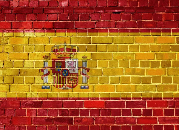 Bandera de España en una pared de ladrillo — Foto de Stock