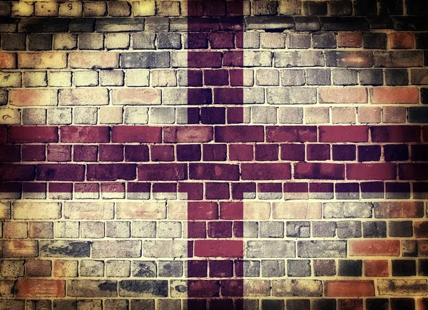 Grunge England Flagge auf einer Ziegelwand — Stockfoto