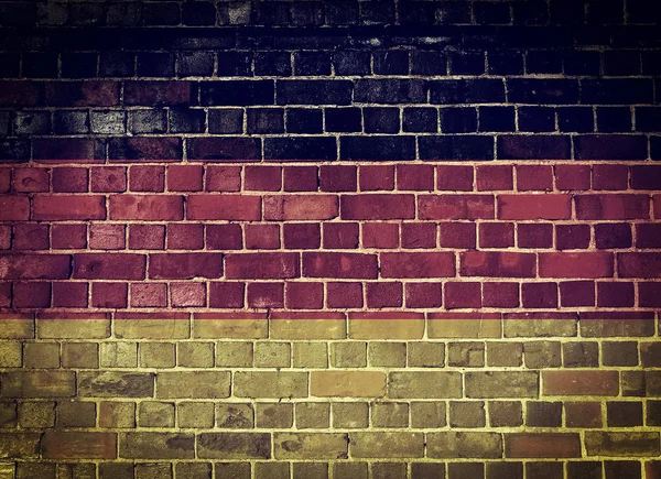 Grunge Alemania bandera en una pared de ladrillo — Foto de Stock