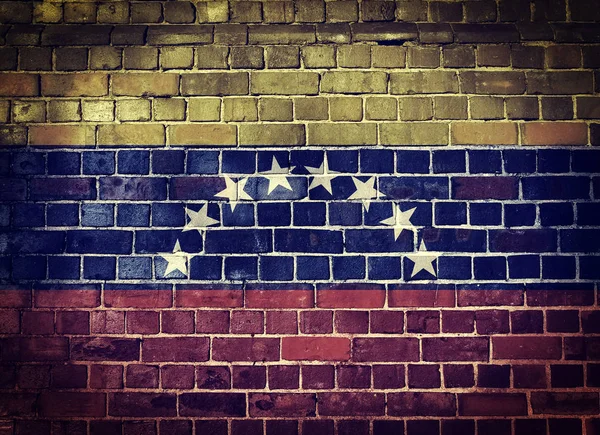 Grunge Venezuela flag on a brick wall — Stock Photo, Image