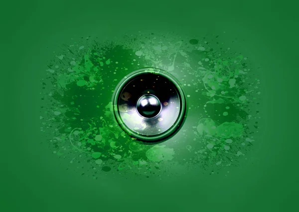 Musik-Lautsprecher auf grünem Hintergrund — Stockfoto