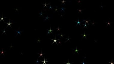 Siyah zemin üzerinde parlayan bokeh ışık efektiyle uçan renkli yıldız şekilli konfeti