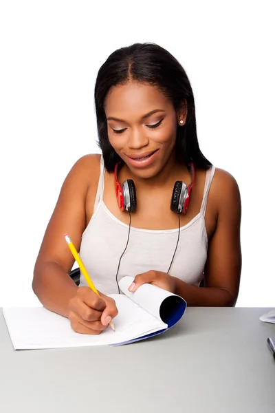 Glad teenage student göra läxor — Stockfoto