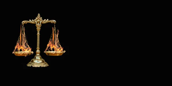scales with burning tasses on a black background