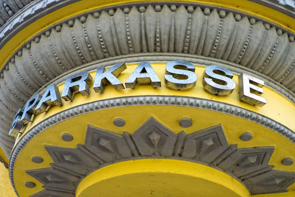 Savings bank logo over the entrance to the bank