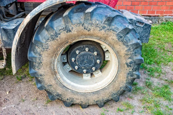 Big tire at a tractor at a village