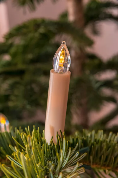 White candle on a Christmas tree — Stock Photo, Image