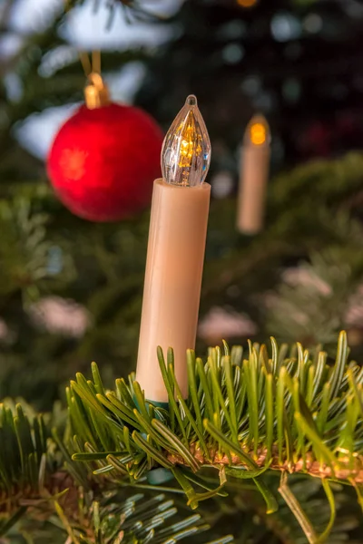 White candle on a Christmas tree — Stock Photo, Image