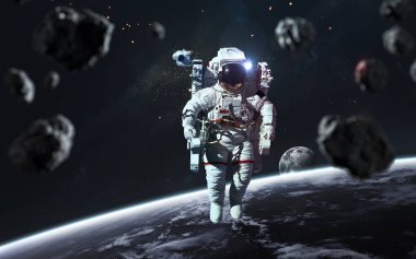 Astronot asteroit alanındaki uzay yürüyüşünde. Bu görüntünün ögeleri