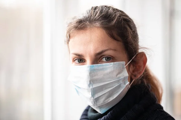 Woman with protection mask against virus pandemic of coronavirus COVID-19 or flu and influenza viruses diseases.