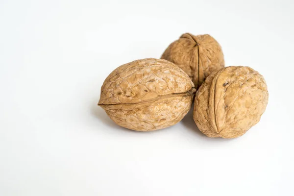 Three walnuts on white — Stock Photo, Image