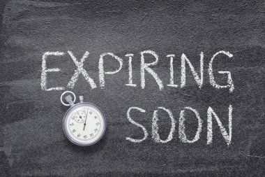 expiring soon phrase written on chalkboard with vintage precise stopwatch clipart