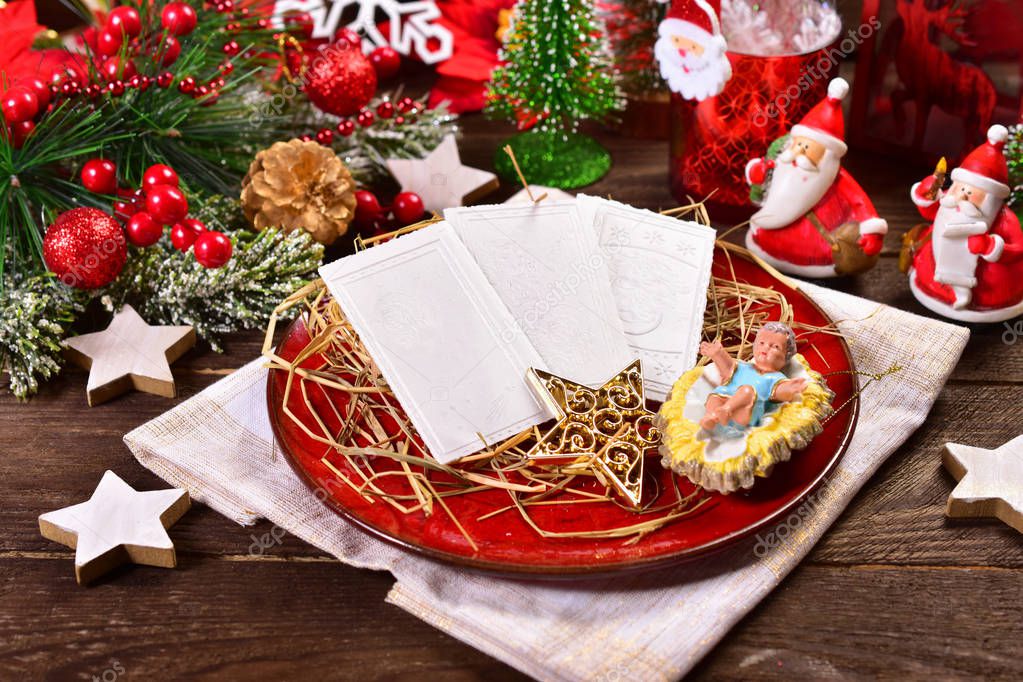 christmas eve wafers on plate with hay
