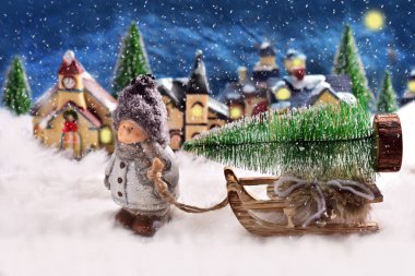 kış gece sahne slad Noel ağacı ile çekerek bir çocukla