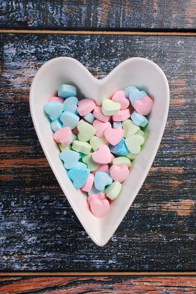 Heart shaped bowl with colorful sugar candies for valentines — Stock Photo, Image