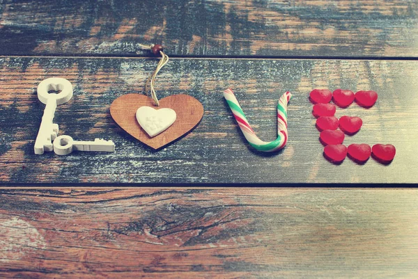 The word LOVE made of various objects in vintage style — Stock Photo, Image