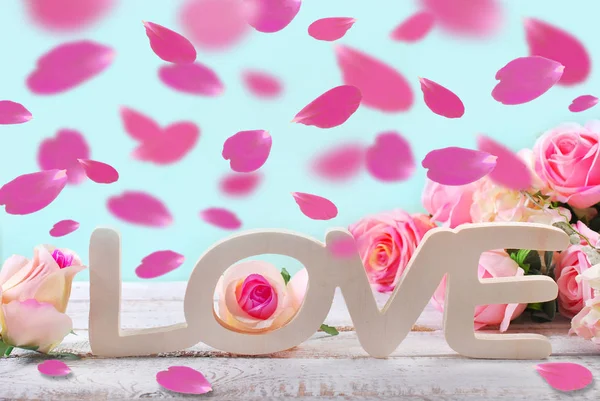 Romantic love background with falling rose petals — Stock Photo, Image