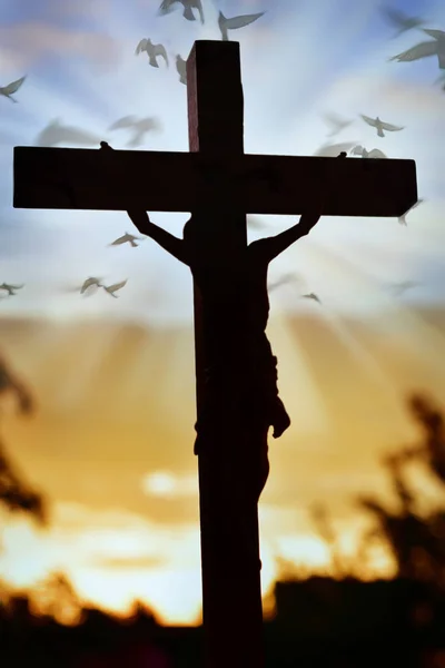 Jesus Christ cross over sunset sky — Stock Photo, Image