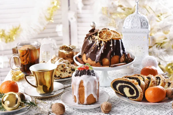 Traditional cakes for Christmas on festive table — Stock Photo, Image