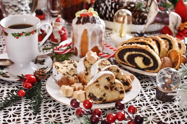Traditional cakes for Christmas on festive table — Stock Photo, Image