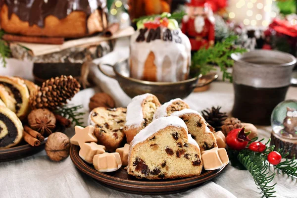 Christmas stollen cake on festive table in rustic style — 图库照片