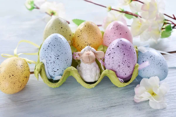 Easter Decoration Lamb Figurine Colorful Eggs Carton Box Flowers Blue — Stock Photo, Image