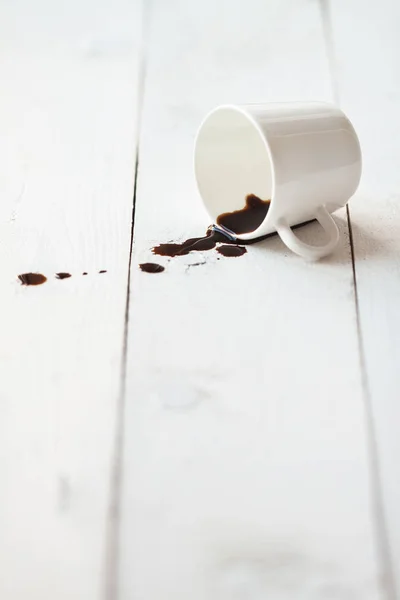 Coffee spilled on white table — Stock Photo, Image