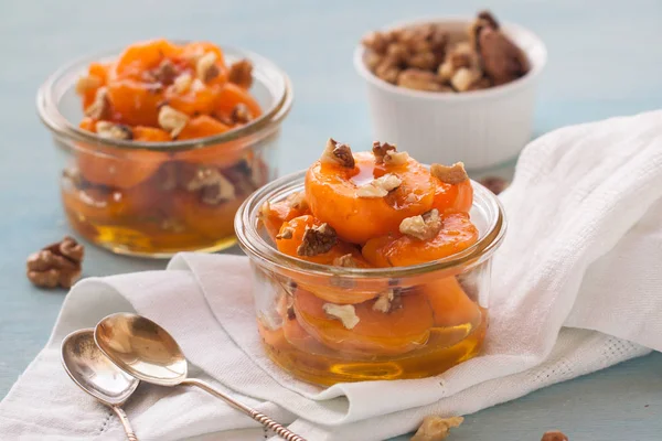 stock image Baked apricots with honey and walnut 